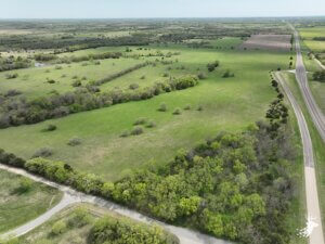 Build-Site on Pavement with Small Pond photo